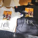Custom boxing sponsorship shirts with logos and branding prominently displayed, designed for sporting event promotions.