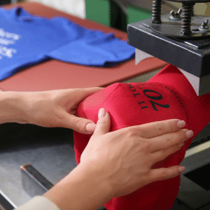 Excited group wearing custom printed T-shirts with logos for an event.