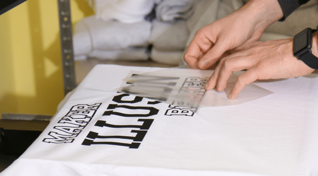 Excited group showing off custom printed T-shirts for an event in Brisbane