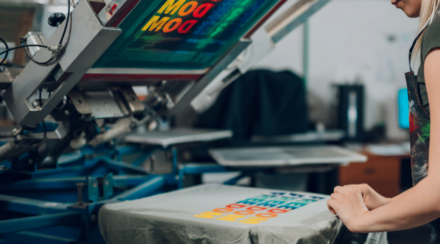 Custom DTG printed T-shirts with vibrant full-colour designs showcased at a Brisbane event